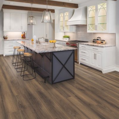 luxury vinyl plank flooring in a bright rustic kitchen